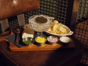 toronto-restaurants-st-johns-tavern-entertainment-district-caviar A tin of caviar on ice is served with grated egg, crème fraîche, minced shallots, kettle chips, water crackers and Tabasco