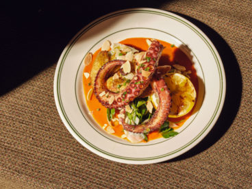 toronto-restaurants-st-johns-tavern-entertainment-district-octopus Slowly-poached and oven-baked octopus is blowtorched to crispiness and served with fingerling potatoes. It’s finished with salsa verde and a house romesco